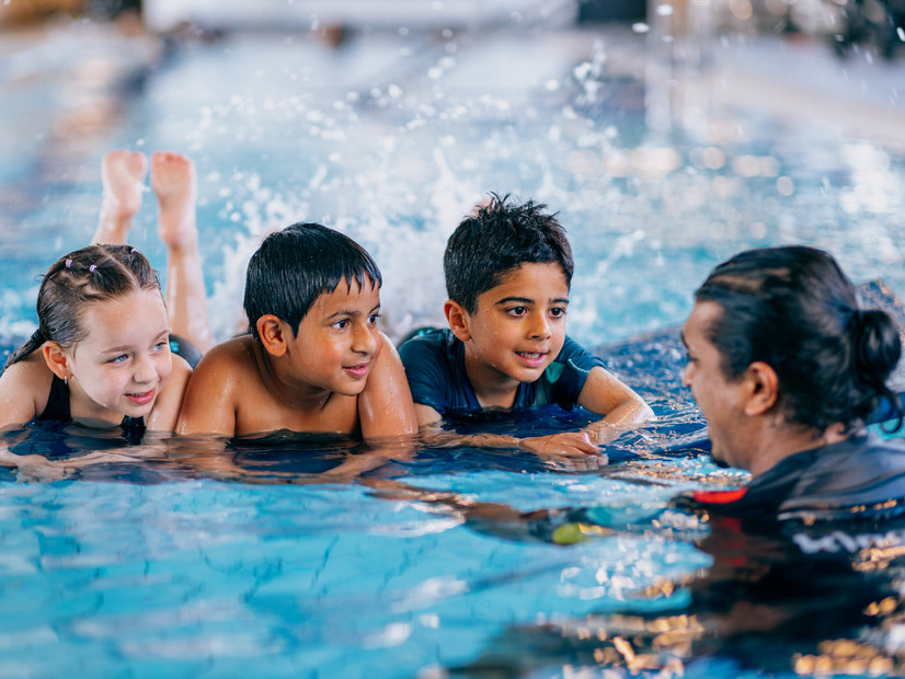 Young children learning how to swim