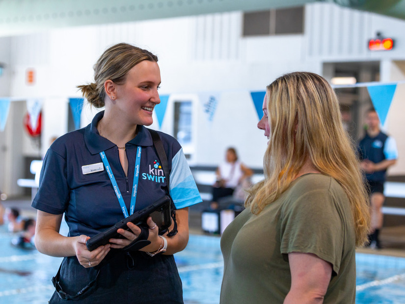 Kingswim staff chatting to customer