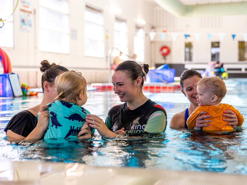 Families taking part in a Kingswim lesson